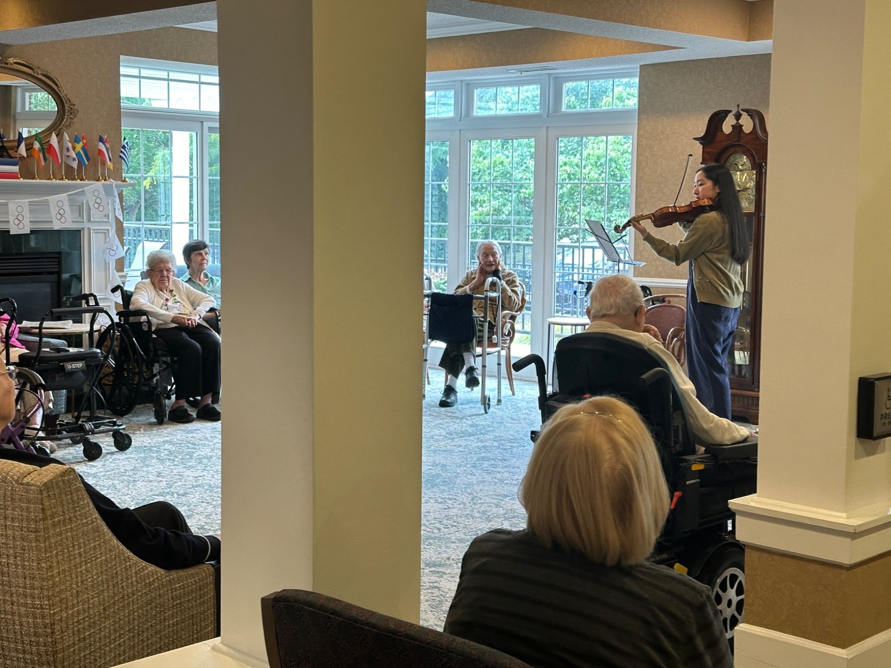 Violinist performing for residents with Harmony Healers